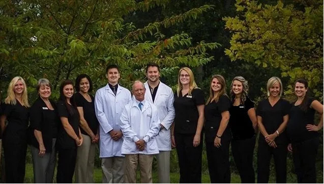 Dental team group photo with many of the doctors and hygienists
